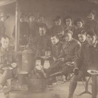 Australian soldiers in a mess tent (World War One postcard)