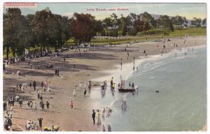 Postcard, with a photo of Long Beach (Tas.), featuring some holiday-makers and sightseers