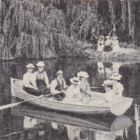 Postcard, with a photo of some people in a rowboat on the Murrumbidgee river (early 20th Century)