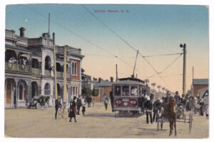Postcard, with a photograph of a street in Henley Beach (South Australia), featuring a tram (early 20th Century)