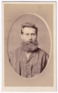 Carte de visite, with a photograph of a man, from the late 19th century