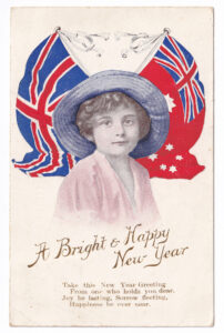 Postcard, with a picture of a child with the Union Jack and the Australian Red Ensign, 1917.